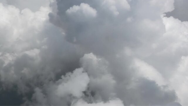 The outside view from inside of an airplane flying through the clouds