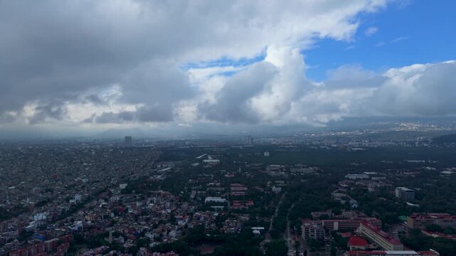 Large gray cloud formations over Mexico City seen from drone
