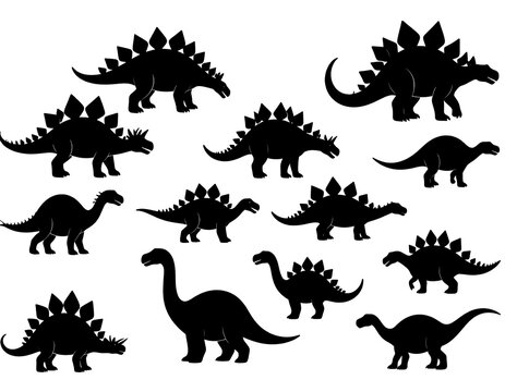 Silhouette group of various prehistoric dinosaur species, black against a white background