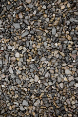 Natural stones background with mixed textures and colors.