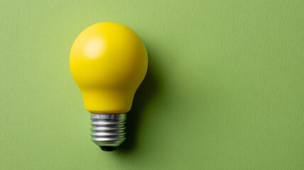 Yellow lightbulb on a green background.