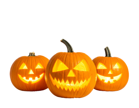 Three carved, illuminated pumpkins with grinning faces against a black background