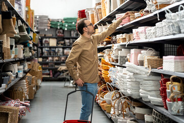 Man shopping for baskets in home goods store