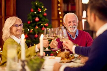 Happy Dinner Toast With Family By Christmas Tree During New Year Celebration Gathering Joy