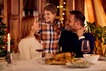 Family Celebration Of Christmas Dinner At A Festive Table With Warmth And New Year Cheer