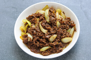 Homemade stir fried beef and tender onions, ready to be enjoyed.