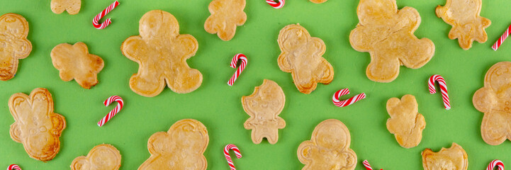 Christmas cookies background with various gingerbread man biscuits