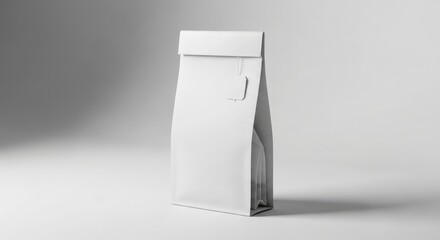 A plain white paper bag stands upright, showcasing a simple, clean design on a light background.