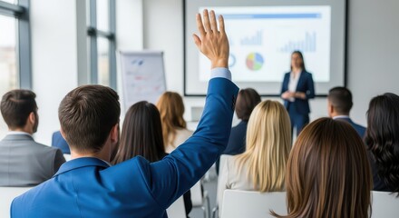 Audience member raises hand during business presentation