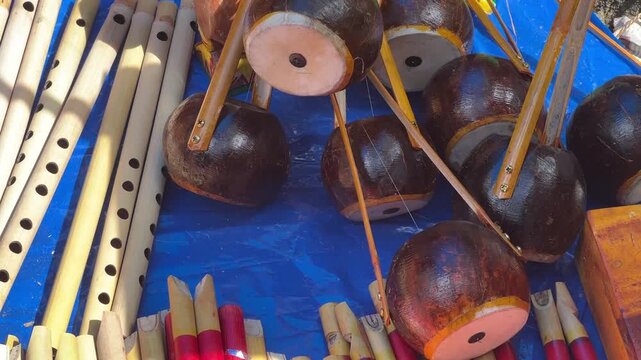 Different types of wooden instruments like Bansuri, ektara made by handicraft artist sold in Shantiniketan, West Bengal. 