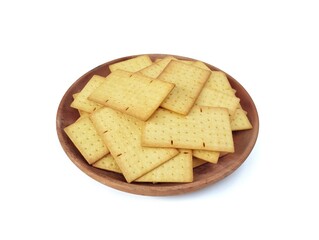 Pile of square biscuits crackers on plate isolated on white background. High angle view 