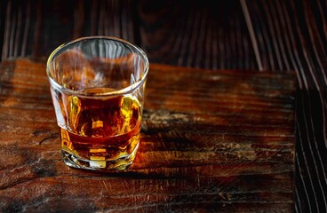 Strong alcohol drink. Whisky in glass, Whisky, bourbon or cognac. Hard strong alcoholic drink