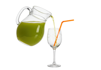 Isolated Pitcher of green juice pouring into glass with straw ready to serve to patrons