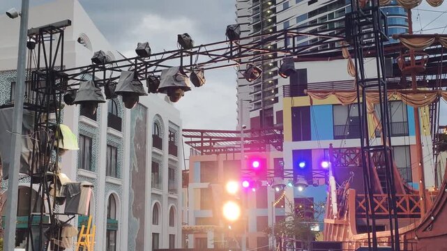 Multicolored spotlights on an outdoor stage.