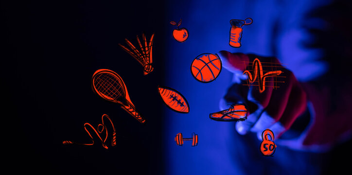 Dynamic digital interface featuring a hand engaging with glowing sports, fitness, and wellness icons. A modern concept for an active, healthy li