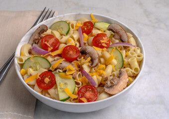 macaroni salad with tomatoes and mushrooms