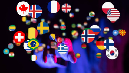 A hand reaching towards numerous country flags, symbolizing global unity, diversity, and...