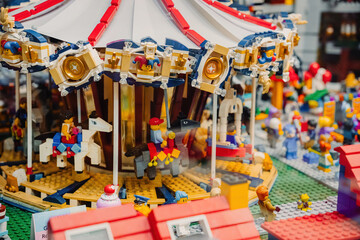 Naklejka premium Prague, Czechia - September 20, 2025: Elegant LEGO French Carousel set with moving horses and charming details