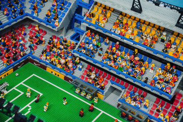 Naklejka premium Prague, Czechia - September 20, 2025: Colorful LEGO football stadium packed with cheering fans