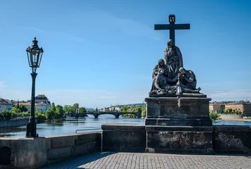 Canvas schilderij Karelsbrug Statue of the Lamentation of Christ (Pietà) on Charles Bridge over the Vltava River in Prague Old Town, Czech Republic, photographed on a bright morning.  © Kyaw Thiha