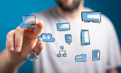 Image depicting a person interacting with various digital devices, showcasing cloud computing and data connectivity.