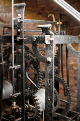 Antique church clock mechanism with metal gears. Perfect for illustrating vintage machinery, time concepts, history, or industrial design.