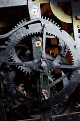 Antique church clock mechanism with metal gears. Perfect for illustrating vintage machinery, time concepts, history, or industrial design.