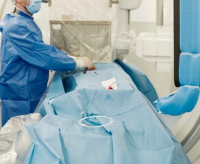 Medical professionals prepare for a liver embolization procedure, utilizing advanced microspheres to target tumors while ensuring patient safety and future treatment options