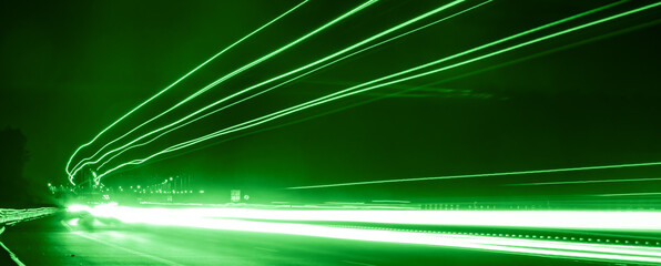 green car lights at night. long exposure