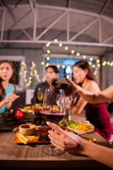  Closeup business woman holding a glass of wine