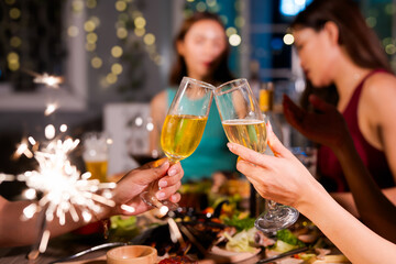  A group of beautiful girls at a company party, drinking, celebrating New Year, club party with friends.