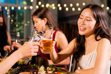 food and drink male friends are happy drinking beer and clinking glasses at a bar or pub.