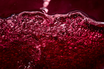  Macro shot of red wine in motion.