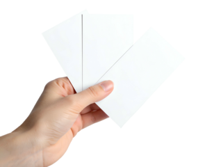 Close-up of a person's hand holding three blank rectangular cards against a black backdrop