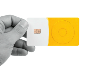 A hand holding a white and yellow card with a chip, set against a black background