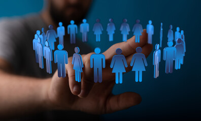 A hand reaching towards a circular group of stylized people, symbolizing community, teamwork, and...