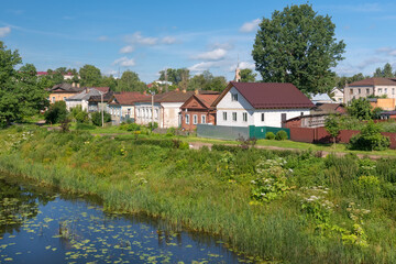 View of residential buildings on Mikhail Ushakov embankment and Kashinka River. Kashin city. Tver region
