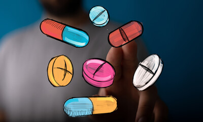 Stock photo of hand interacting with colorful pills and capsules, representing medicine, healthcare, or pharmacy.