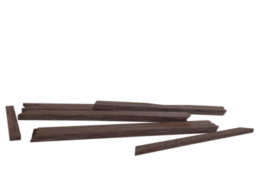A scattered pile of dark brown wooden planks and fragments, varying in length and shape, lying horizontally against a transparent background
