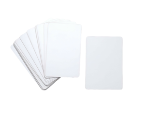 A close-up of two sets of blank, white playing cards on a solid black background