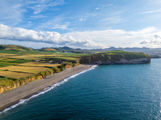 Areal de Santa Barbara Beach, Green Lush Fields and Atlantic Ocean on Sunny Day. Azores, Sao Miguel Island. Portugal. Aerial View