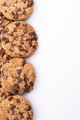 Chocolate chip cookies on a white background. Vertical copy space for advertising.