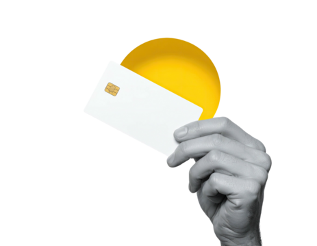 A grayscale hand holds a white credit card with a yellow circle behind it