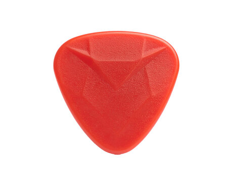 A bright red, textured, triangular plectrum isolated on a stark black background