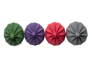 Four colorful, starburst-shaped objects arranged horizontally against a stark black background