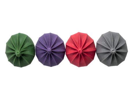 Four colorful, starburst-shaped objects arranged horizontally against a stark black background