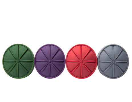 Four colorful circular objects, each with radiating segments, against a black background
