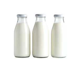 Three vintage glass bottles filled with fresh white dairy product, presented against black
