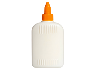 Cream-colored plastic squeeze bottle with orange nozzle against a stark black background