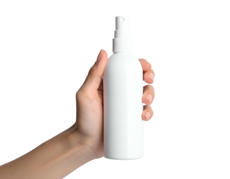Human hand holding a white spray bottle against a stark black background, minimal setup